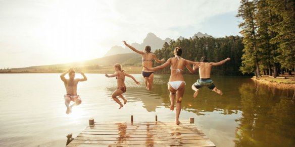 bigstock-Friends-Jumping-Into-The-Water-119847851